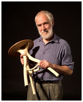 Chris Cattle holding one of his stools